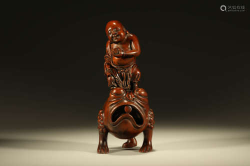 A CARVED BOXWOOD FIGURE OF LIU HAI