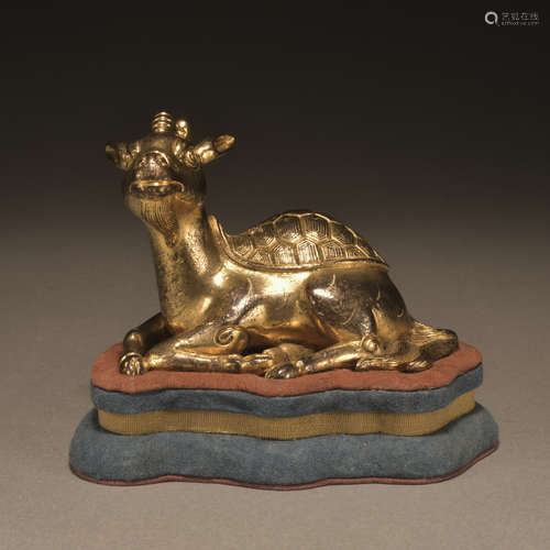 A GILT-BRONZE AUSPICIOUS BEAST