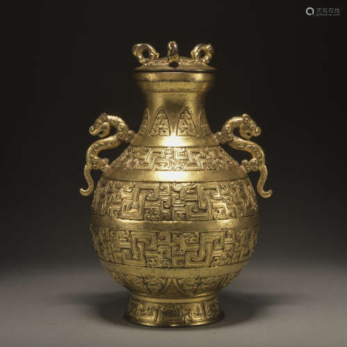 A GILT-BRONZE VASE