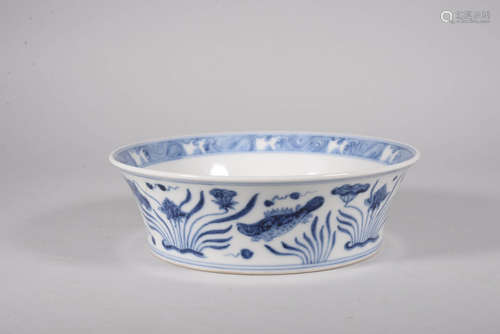 A BLUE AND WHITE FISH BOWL