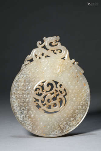 A RAISED DRAGON JADE DISC