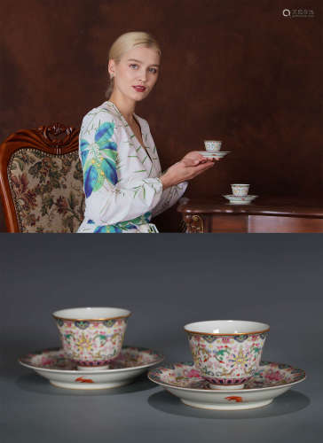 A SET OF FAMILLE ROSE CUPS AND SAUCERS