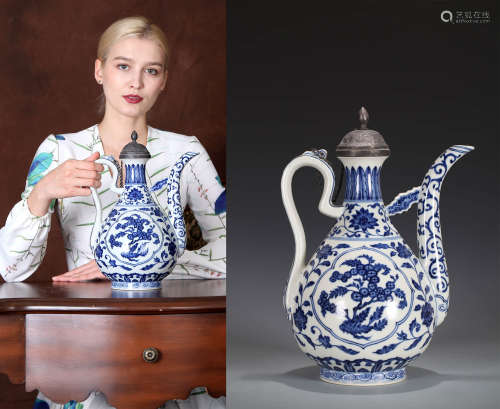 A BLUE AND WHITE FLOWER AND FRUIT EWER