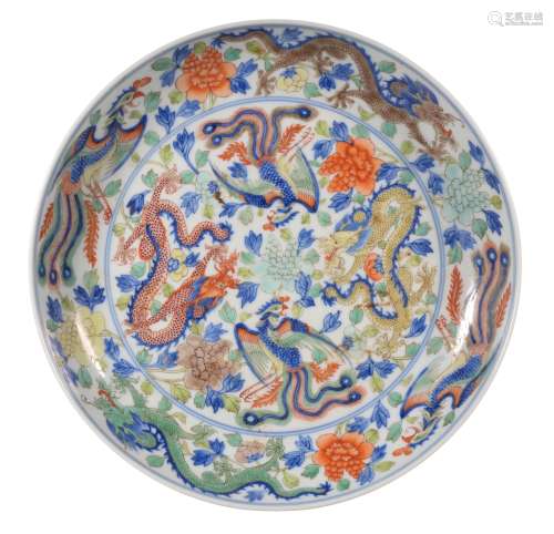A BLUE AND WHITE FAMILLE VERTE DRAGON AND PHOENIX PLATE