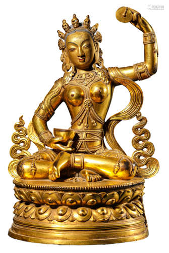 A GILDED COPPER STATUE OF TARA