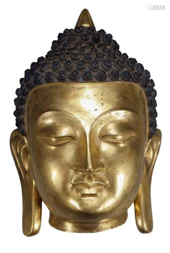 A GILDED COPPER HEAD OF BUDDHA
