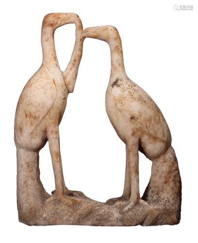 A MARBLE CARVING OF TWO CRANES