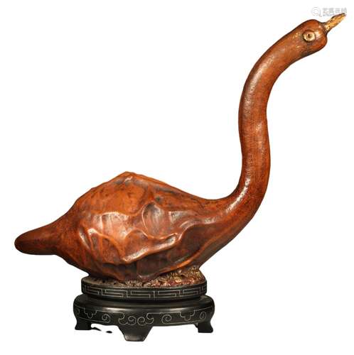 A GOOSE-SHAPED ORNAMENT