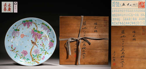 A BLUE-GROUND FAMILLE ROSE FLOWER AND BIRD PLATE