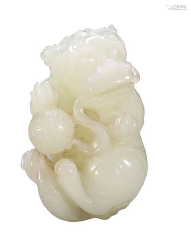 A HETIAN JADE LION PLAYING BALL