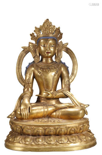 A GILT-COPPER FIGURE OF SHAKYAMUNI