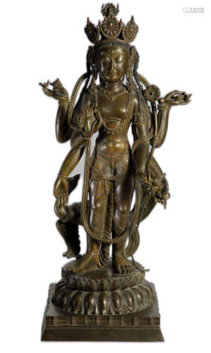 A COPPER ALLOY FIGURE OF
SIX-ARMED AVALOKITESVARA