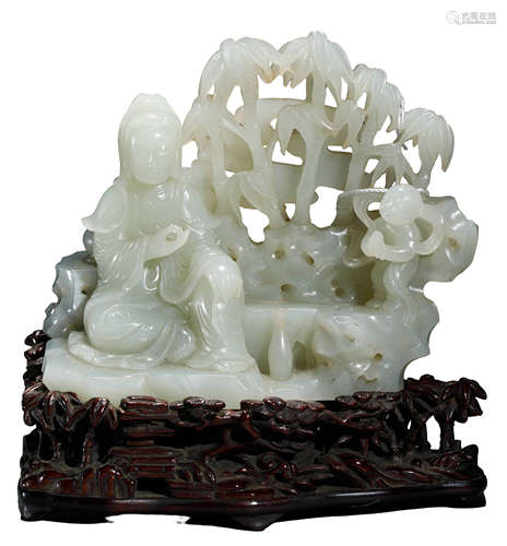 A HETIAN JADE FIGURE OF GUANYIN