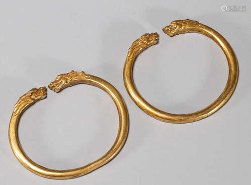 A PAIR OF GILT-COPPER DRAGON BRACELETS