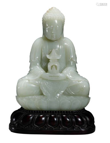 A HETIAN JADE FIGURE OF SHAKYAMUNI