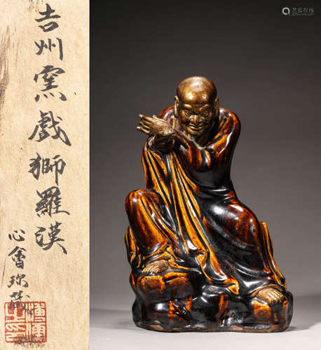 A JIZHOU PORCELAIN STATUE OF ARHAT