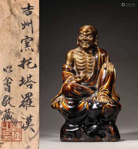 A JIZHOU PORCELAIN STATUE OF ARHAT