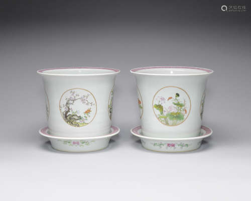 Pair of famille rose 'medallion' celadon ground jardinières and stands.  Daoguang four-character marks, Republic