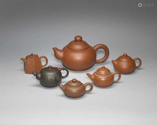 A large red clay stoneware teapot.  Yixing four-character mark