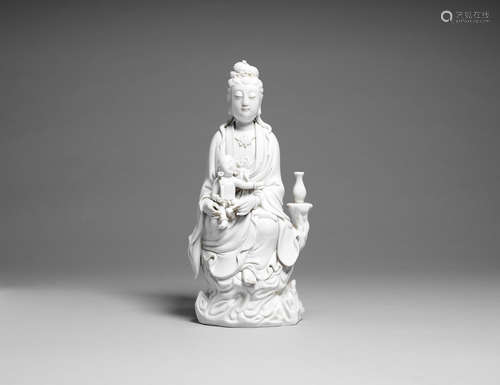 A Dehua figure of Guanyin and a child.  He Chaozong seal mark, Late Qing Dynasty