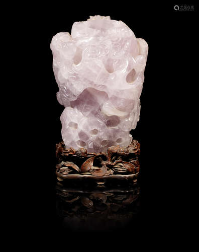 A carved rose quartz trunk form vase.  19th century