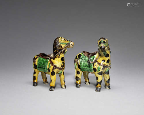 A rare pair of famille verte biscuit horses.  Kangxi