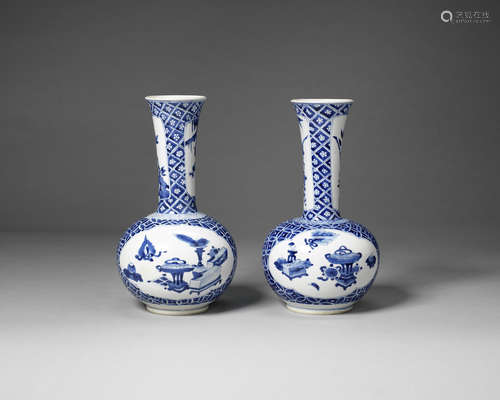 A pair of blue and white bottle vases.  Kangxi