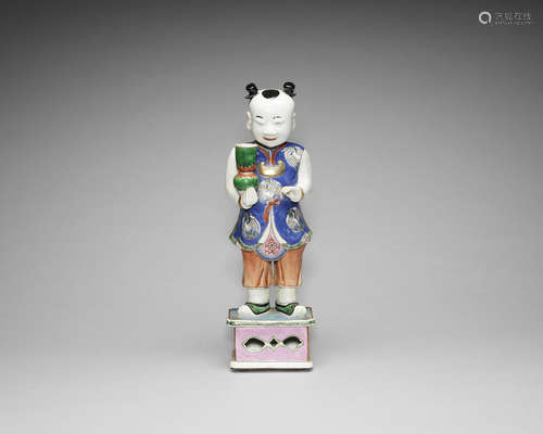 A famille rose figure of a boy.  20th century