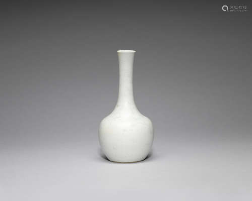 A celadon-glazed 'dragon' bottle vase.  Kangxi