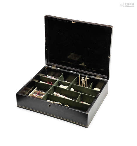 A Canton ivory puzzle set and case.  19th century