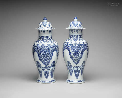 A near pair of large blue and white baluster vases and covers.  Kangxi