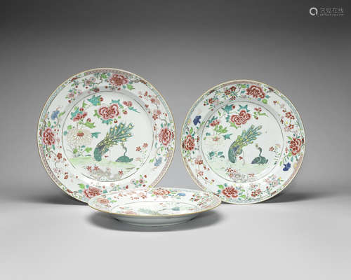 A set of three large famille rose 'peacock' dishes.  Yongzheng/Qianlong