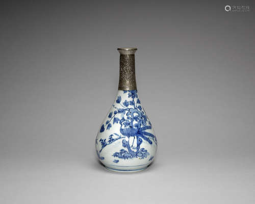 A white metal-mounted blue and white bottle vase.  The porcelain, Wanli, the mount possibly Turkish, 19th century