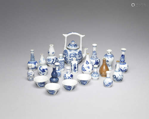 A rare blue and white miniature teapot and cover, four tea bowls and a collection of 'doll's house' porcelain.  Kangxi and later