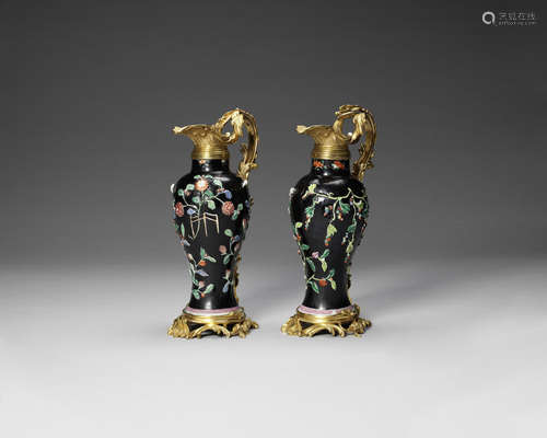 A pair of ormolu-mounted, black ground famille rose vases.  The porcelain 18th century, the mounts 19th century, probably French