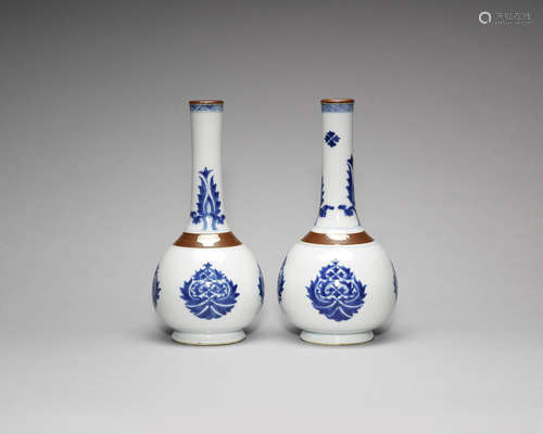 A pair of blue and white and brown-glazed bottle vases.  Kangxi