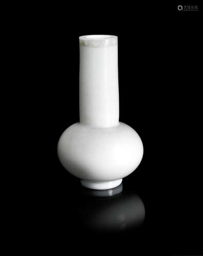 A pale green glass bottle vase.  20th century