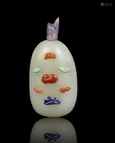 A rare pale green jade semi-precious-stone-inlaid snuff bottle.  19th century