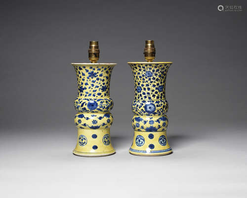 A rare pair of yellow-ground underglaze blue decorated beaker vases, gu.  Kangxi