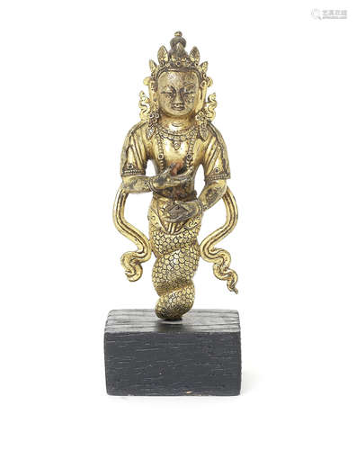 A Tibetan gilt bronze figure of Naga.  18th century