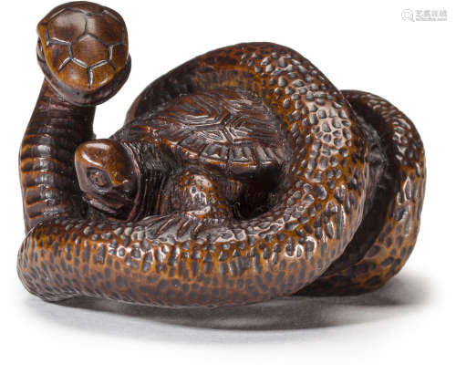 A wood netsuke of a turtle and snake Edo period (1615-1868), early 19th century