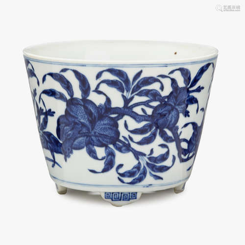 A Chinese blue and white porcelain tripod planter decorated with peaches, qianlong six character mark, republic period