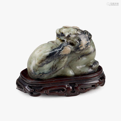 A Chinese mottled green jade recumbent qilin, qing dynasty