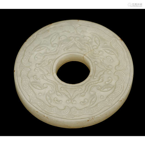 A Chinese white jade 'bi' disc carved to show chilong and archaistic motifs, 19th century