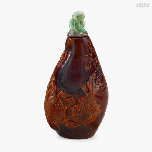 A Chinese amber snuff bottle, carved with two goldfish, 19th century