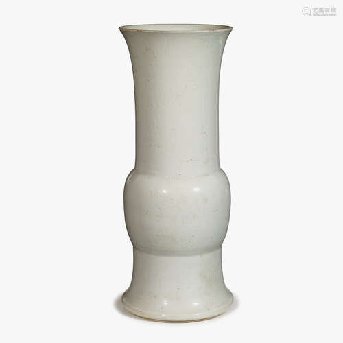 A Chinese white glazed porcelain 'Gu' vase with incised decorations, qing dynasty