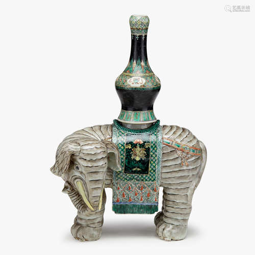 A Chinese famille verte enameled porcelain elephant with mounted detachable vase, early qing dynasty