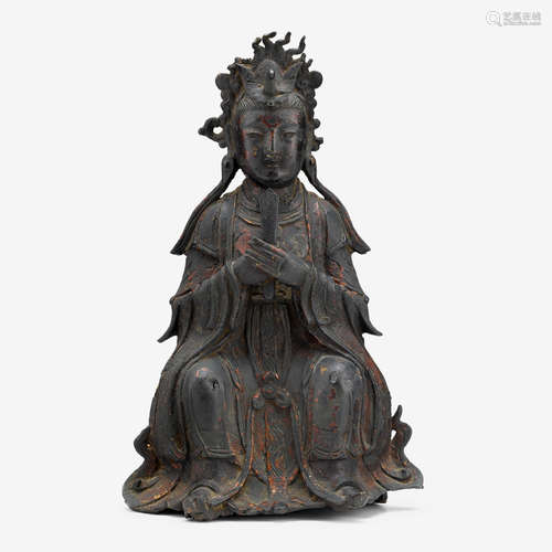 A Chinese polychrome lacquered bronze figure of Guanyin clasping a tablet, late ming dynasty