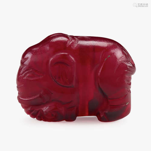 A small and rare Chinese ruby glass elephant-form toggle, 18th century