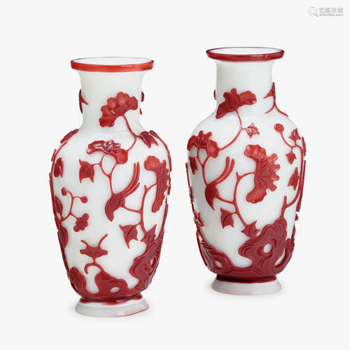 A pair of Chinese red overlay on white glass baluster vases, with birds and peonies, 18th/19th century